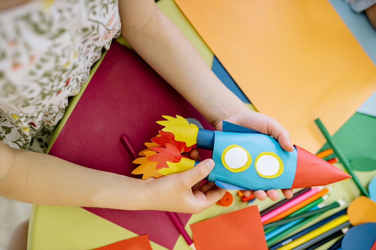 Child building a wooden project at a Bunnings Kids Workshop