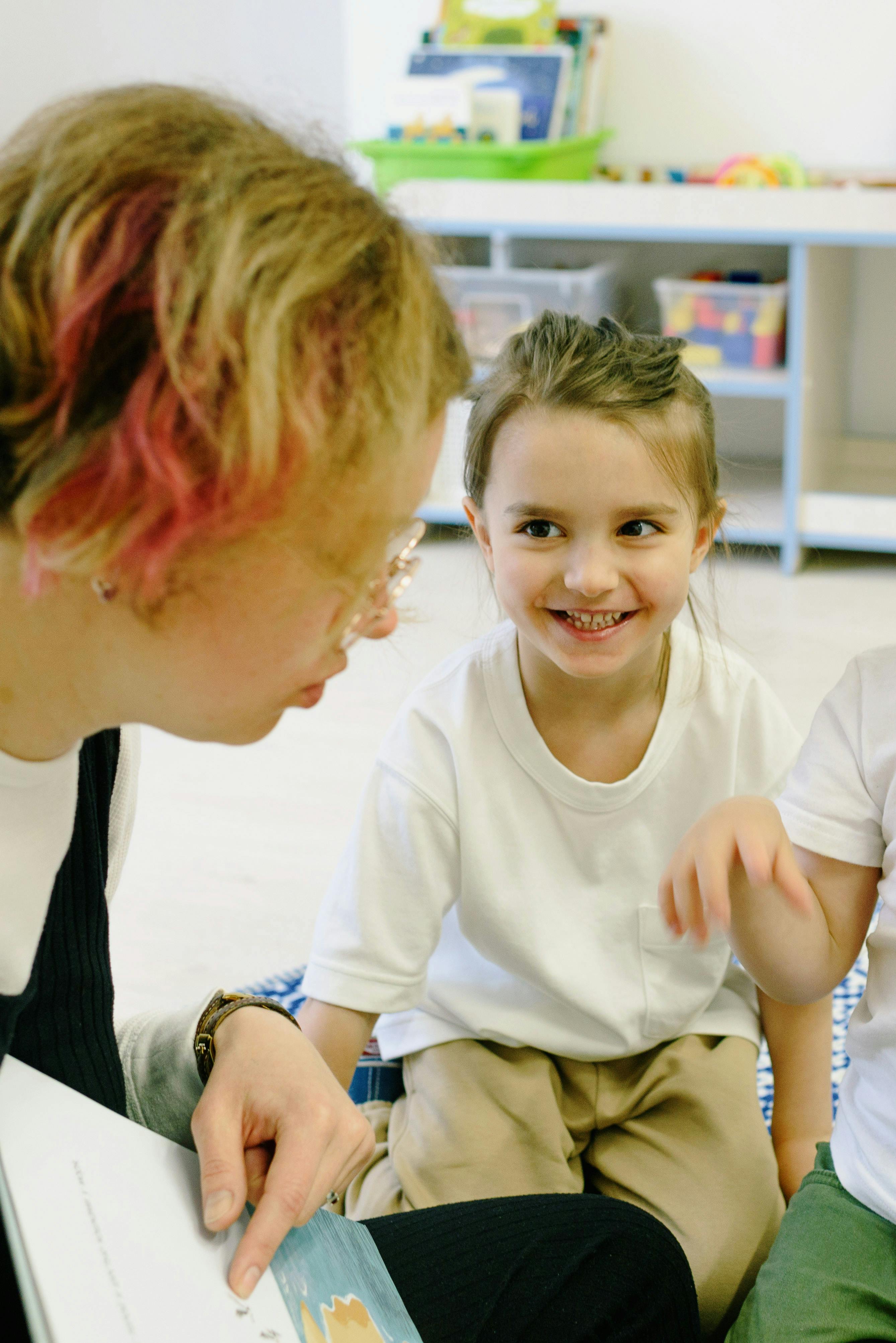 Toddlers singing and moving at a library rhyme time session
